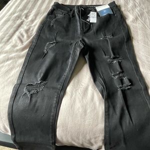Black skinny shredded jeans